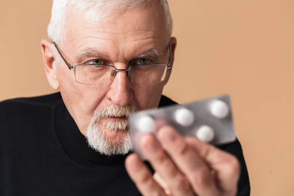 Close up old attractive man with gray hair and beard in eyeglass