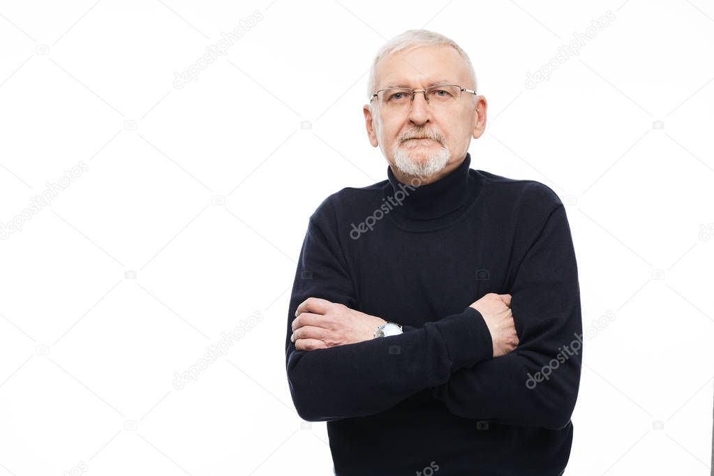 Old handsome man with gray hair and beard in eyeglasses and blac