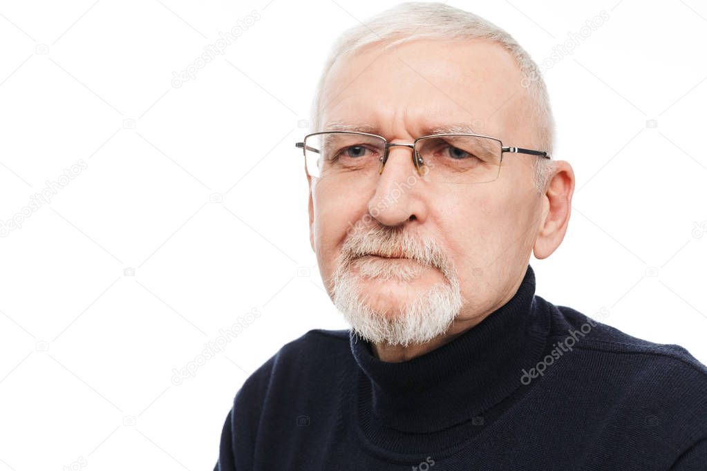 Portrait of old handsome man with gray hair and beard in eyeglas