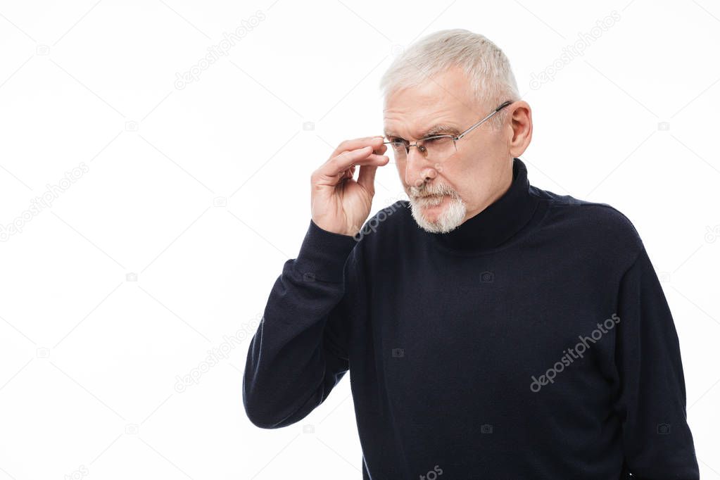 Old attractive man with gray hair and beard in eyeglasses and bl