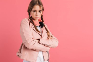 Young angry lady with two braids in leather jacket with headphon