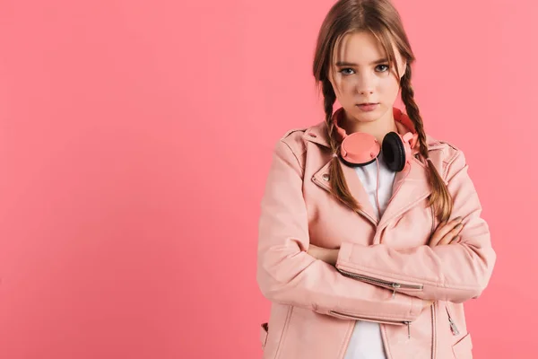 Young serious lady with two braids in leather jacket with headph — ストック写真