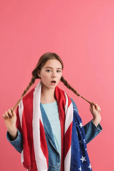 Young surprised teenager girl with two braids amazedly looking i — ストック写真