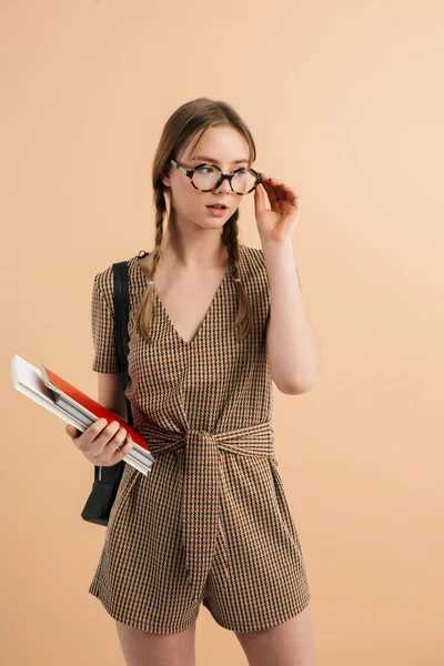 Young attractive lady with two braids in tweed jumpsuit and eyeg — Stock Photo, Image