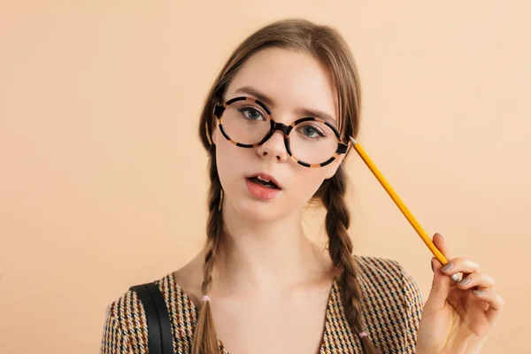 Portrait of young pretty girl with two braids in modern eyeglass — Stock Photo, Image