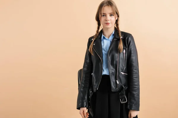 Young beautiful smiling girl with two braids in leather jacket a — Stock Photo, Image