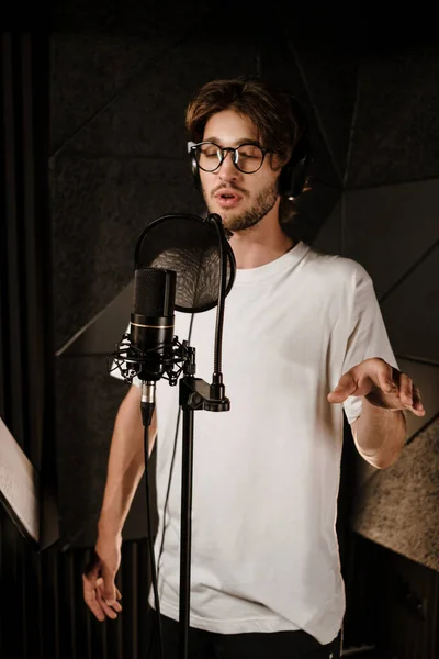 Young Attractive Male Musician Headphones Intently Recording Song New Music — Stock Photo, Image