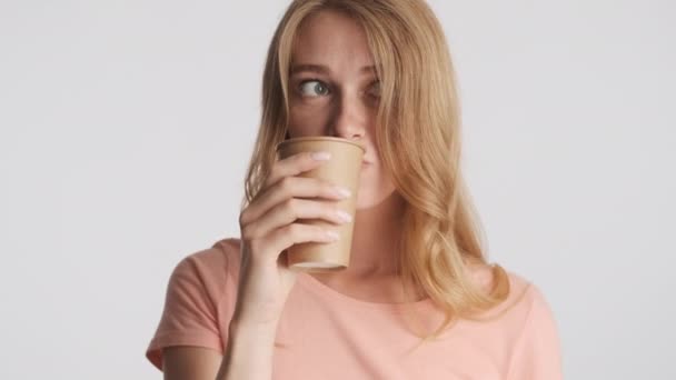 Young Attractive Blond Woman Drinking Coffee Amazedly Looking Camera Gray — Stock Video