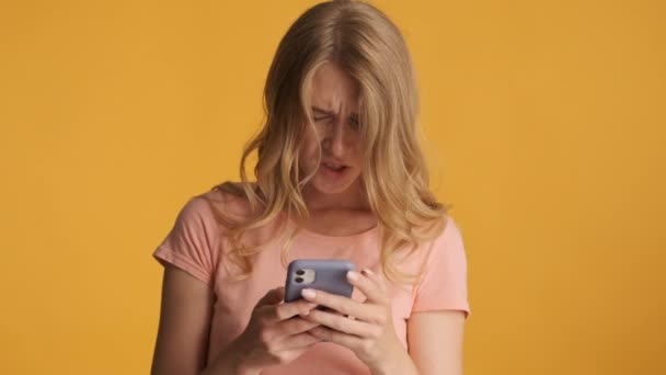 Attractive Upset Blond Girl Using Smartphone Starting Smiling Camera Colorful — Stock Video