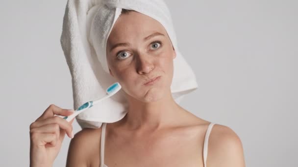 Beautiful Smiling Girl Towel Head Playfully Posing Camera Toothbrush Gray — Stock Video
