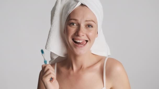 Pretty Cheerful Girl Towel Head Happily Dancing Camera Toothbrush Gray — Stock Video