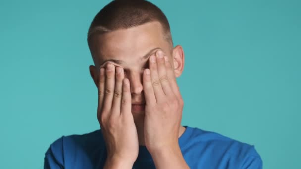 Portrait Young Man Tiredly Rubbing Eyes Camera Colorful Background — Stock Video