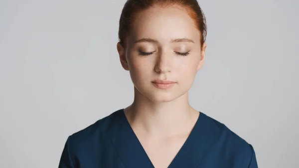 Portrait Young Tired Female Doctor Dreamily Closing Eyes Camera White — Stock Photo, Image