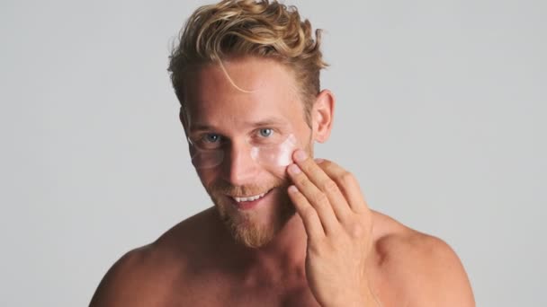 Handsome Cheerful Blond Bearded Man Applying Eye Patches Happily Looking Stock Footage