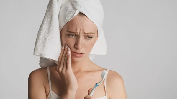 Young Upset Woman Towel Head Sadly Looking Toothbrush Isolated White — Stock Photo, Image