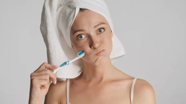 Portrait Girl Towel Head Toothbrush Thoughtfully Looking Camera Isolated White — Stock Photo, Image