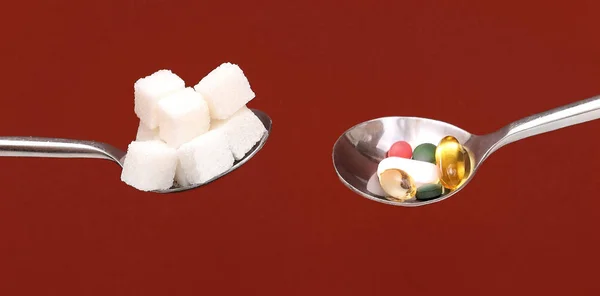 Silver Spoons Full White Sugar Cubes Colorful Pills Both Considered — Stock Photo, Image