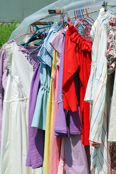 Female clothes sold outside in agricultural fair market kiosk