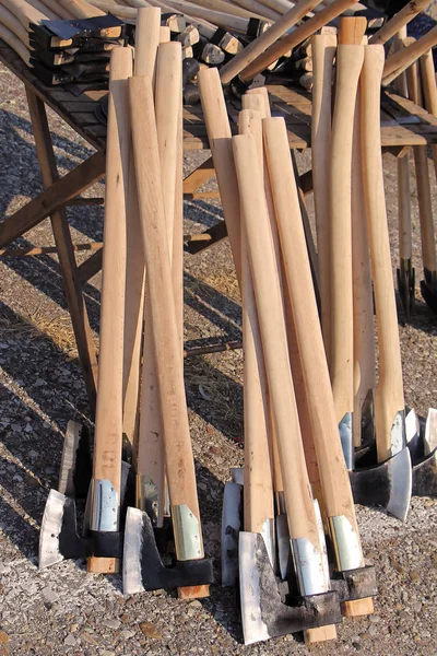 Wooden handle axes pile — Stock Photo, Image