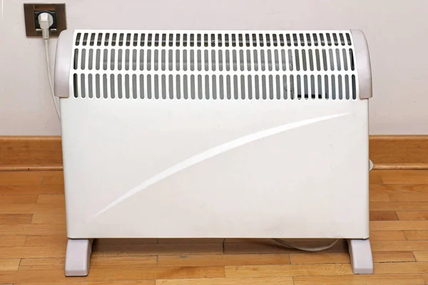 Heater on wooden floor — Stock Photo, Image