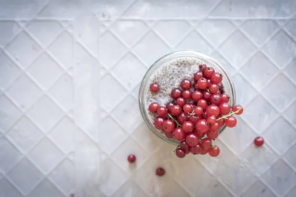 Vegan Chia Pudding with Berries in glass, top view