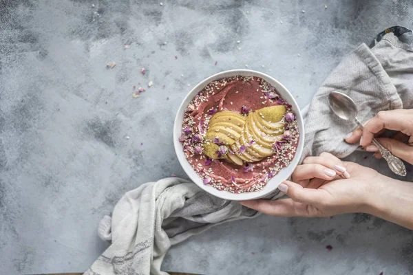 Hands Holding Pink Smoothie Bowl Apples Seeds Flowers — Stock Photo, Image