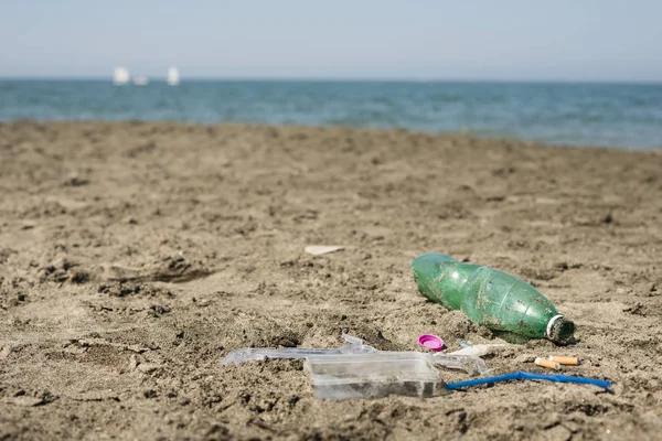 Green Plastic Bottle Cotton Swabs Cap Box Cigarettes Left Sandy — Stock Photo, Image