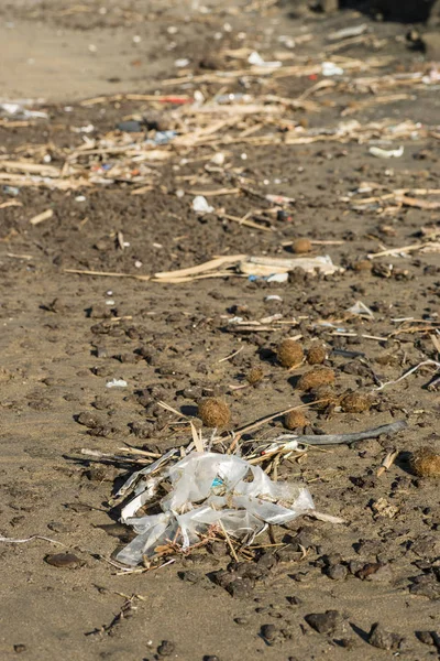 Pollution of Plastic and litter material on sand beach