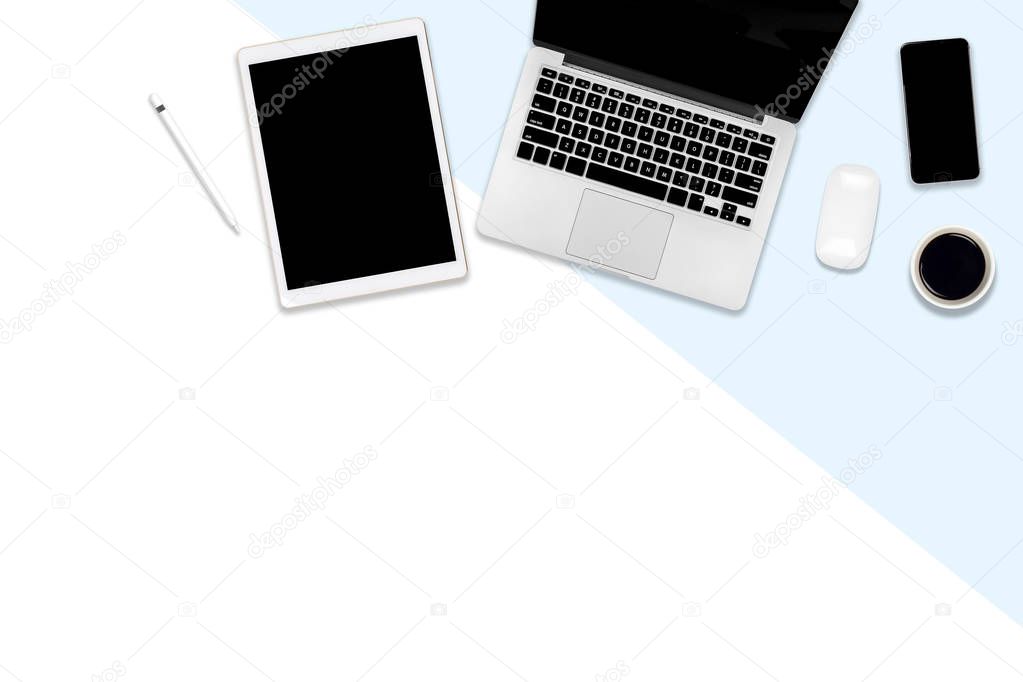 Flat lay photo of office table with laptop computer, digital tablet, mobile phone and accessories. on modern tone background. Desktop office mockup concept.