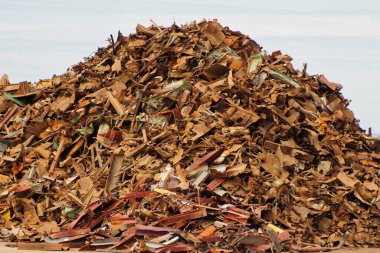 A heap of scrap metal before recycling. clipart