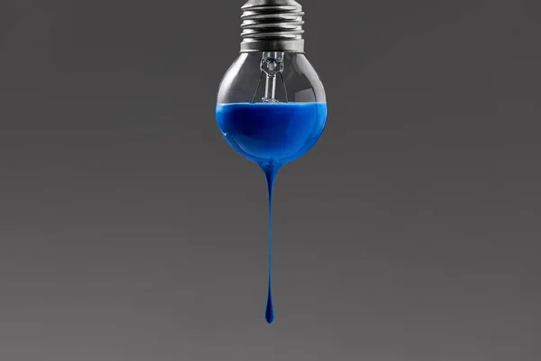 Bulb with blue paint on it — Stock Photo, Image