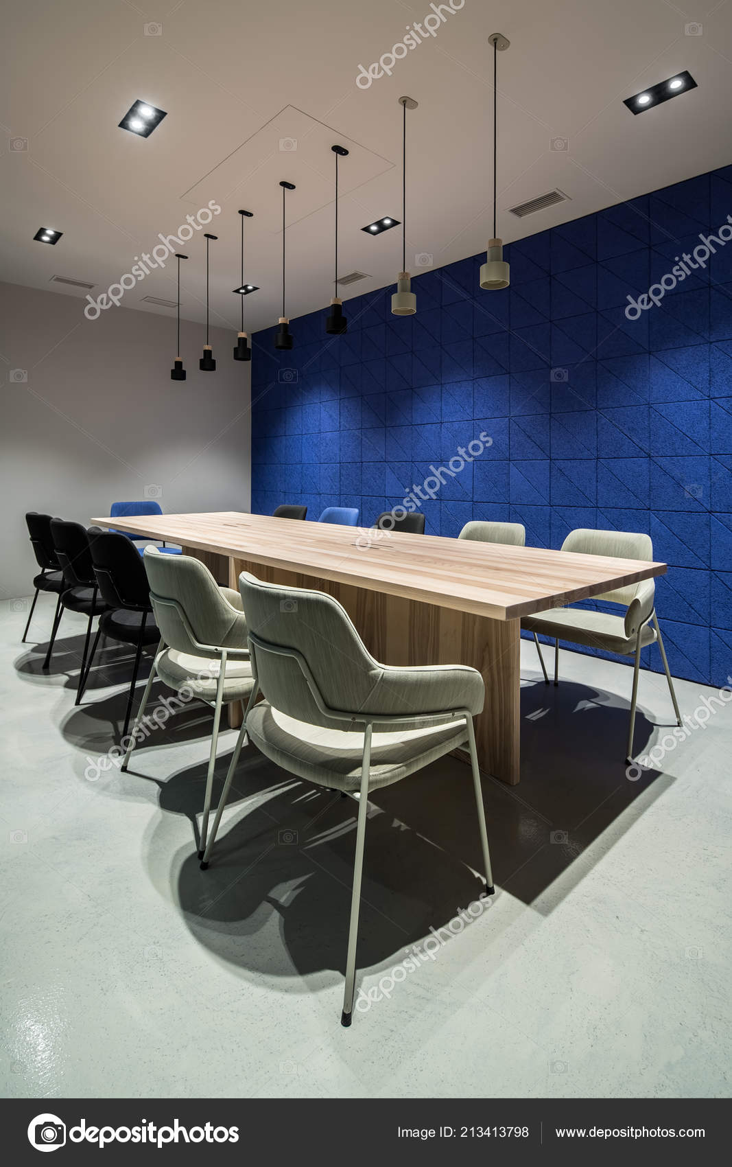 Stylish Conference Room With Gray And Blue Walls Stock