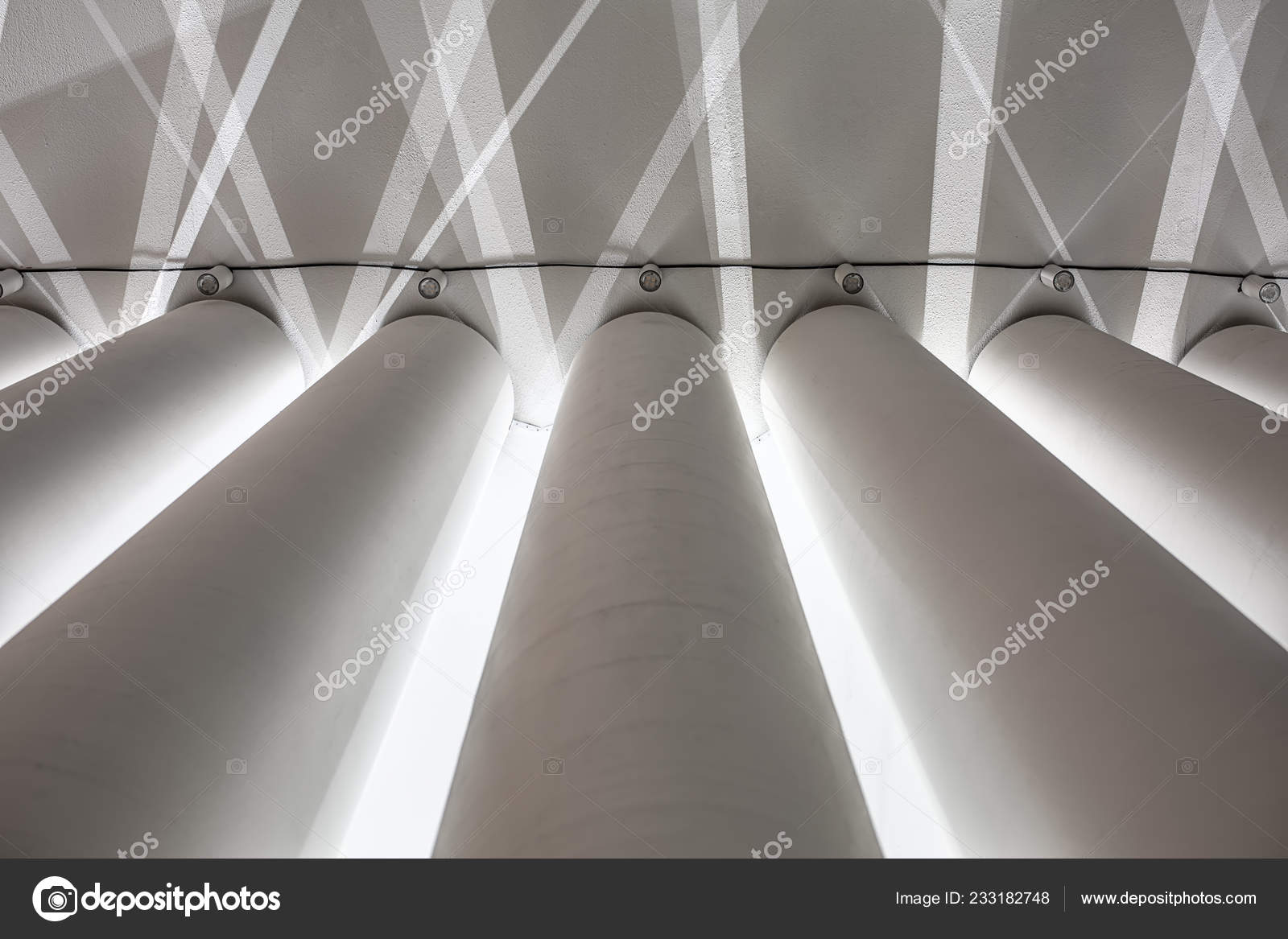 White Textured Columns On The Concrete Ceiling Background