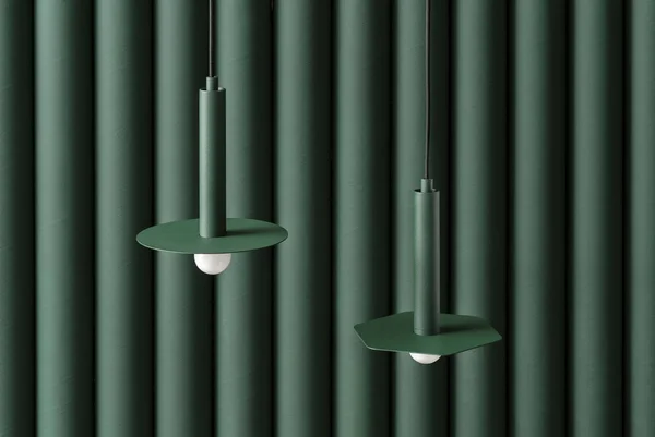 Tmavě zelené kovové lampy, zavěšené na pozadí skládané barevné zdi ve studiu — Stock fotografie