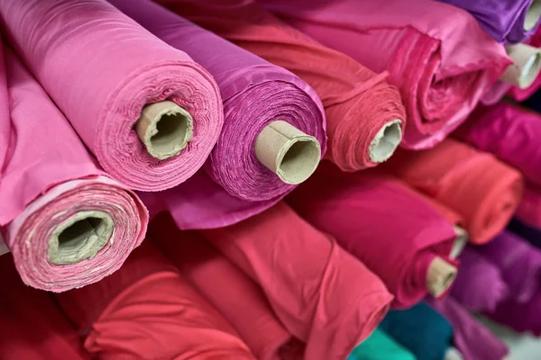 Fabric warehouse with many multicolored textile rolls — Stock Photo, Image