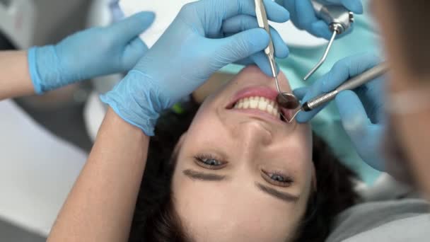 Pretty womans teeth treatment in dental clinic — Stock Video