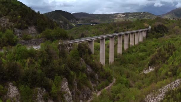 Bridges with cars over green hilly valley — Stock Video