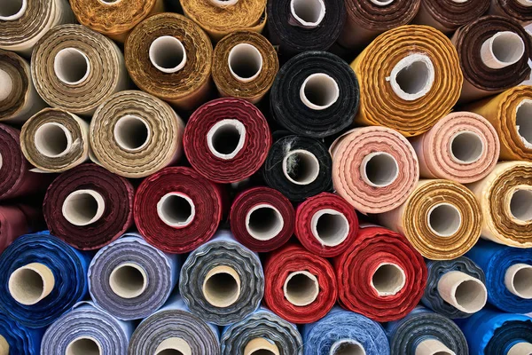 Fabric warehouse with many multicolored textile rolls — Stock Photo, Image