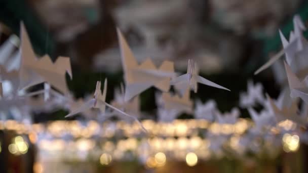 Handmade paper birds hanging and swinging indoors — Stock Video