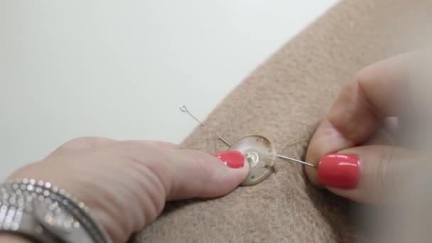 Closeup view at work process in sewing studio — Stock Video