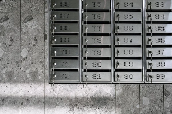 Numbered metal mailboxes with keys in them — Stock Photo, Image