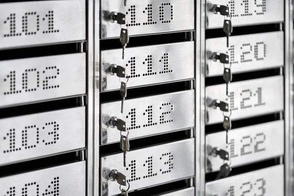 Numbered metal mailboxes with keys in them — Stock Photo, Image