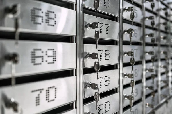 Numbered metal mailboxes with keys in them — Stock Photo, Image