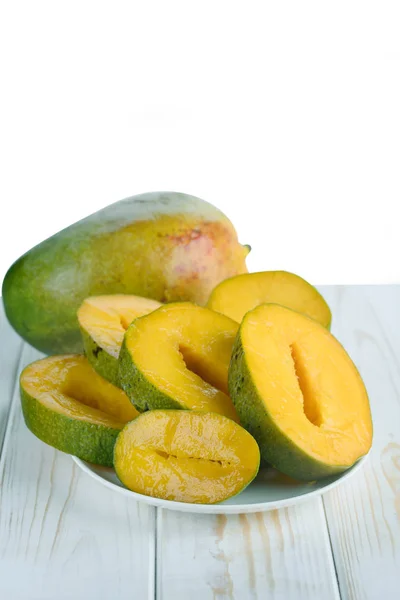 Ripe mango slices on the table