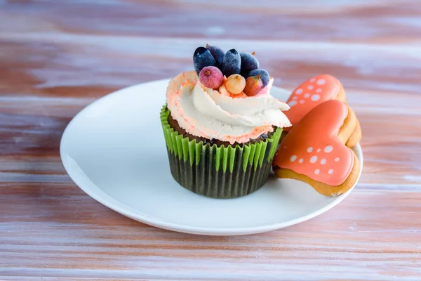 Sweet and tasty cake on a white plate on the table