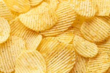 İştah açıcı soyulmuş cips. Yemek fişleri arka plan. Gıda arka plan.