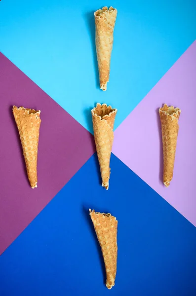 Waffle cone on colored geometric shapes