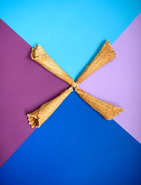 Waffle cone on colored geometric shapes