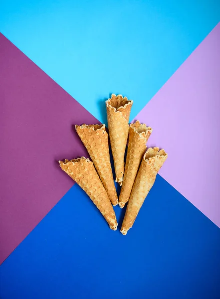 Waffle cone on colored geometric shapes