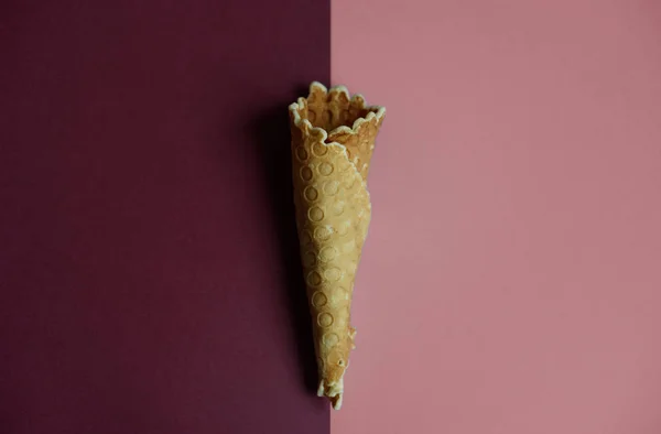 Waffle cone on colored geometric shapes